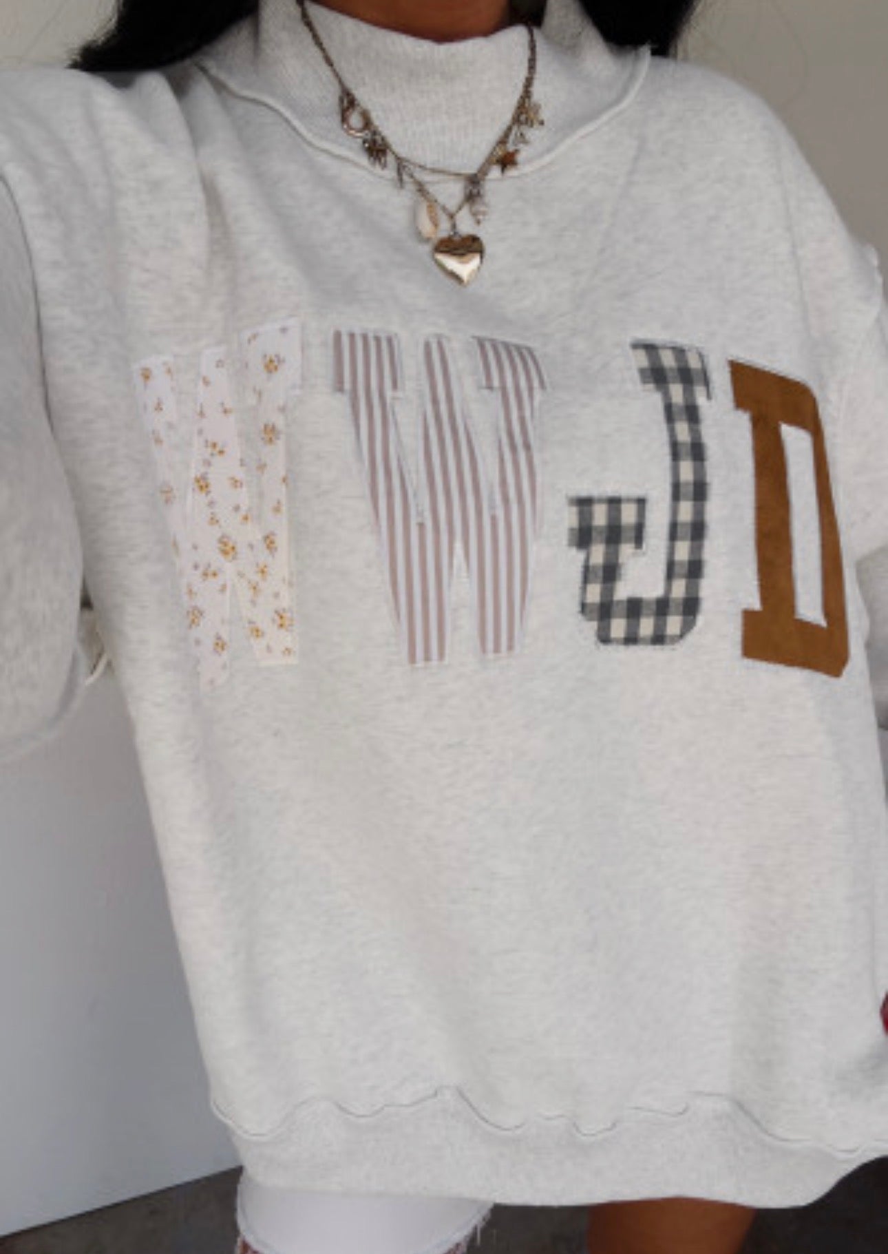 WWJD PATCHWORK SWEATSHIRT